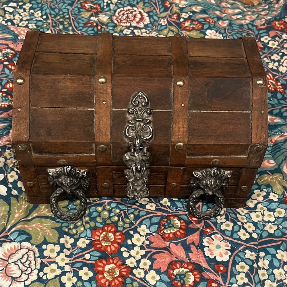 Vintage Ornate Wooden Chest with Metal Lion Accents